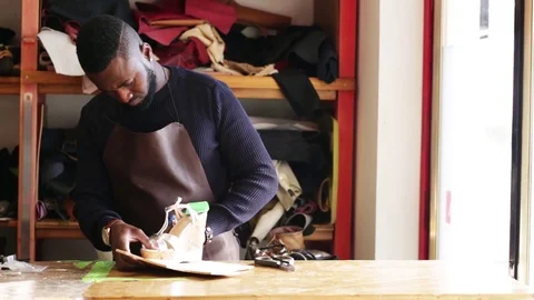 Working day of a African shoemaker Stock Footage 116347093