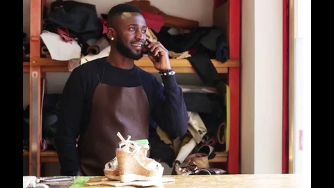 Working day of a African shoemaker Stock Footage 116347253