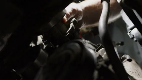 Working day in car service, close up shot of removing antifreeze pump from car Stock Footage 201271928