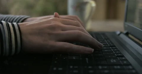 Working from on the deck with a cup of coffee. Stock Footage 49523040