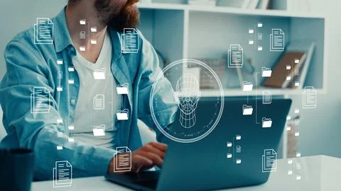 Working with deep fake technology in a modern office setting Stock Photos