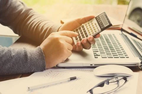 Working on a desk numerical analysis, financial accounting. Graphing Stock Photos