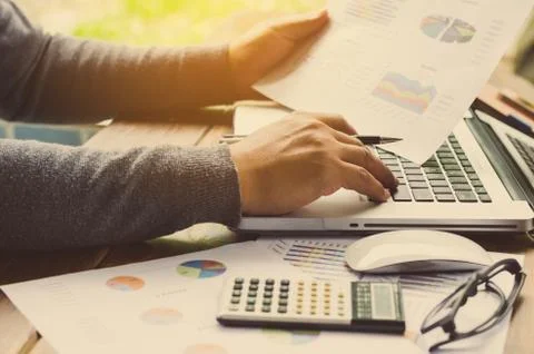 Working on a desk numerical analysis, financial accounting. Graphing Stock Photos