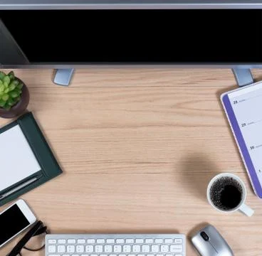 Working desktop in overhead view on oak wood Stock Photos