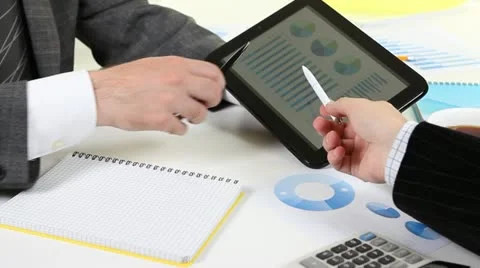 Working with digital tablet touchscreen information Stock Footage 21243239