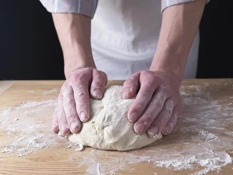 Working with dough on the table. Stock Photos