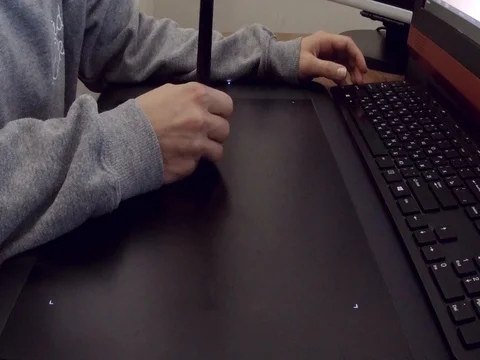 Working with drawing tablet for a computer Stock Footage 77672390