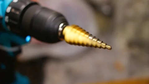 Working drill. rotating drill. screwdriver tool.man with drill makes hole i.. Stock Footage 250380291