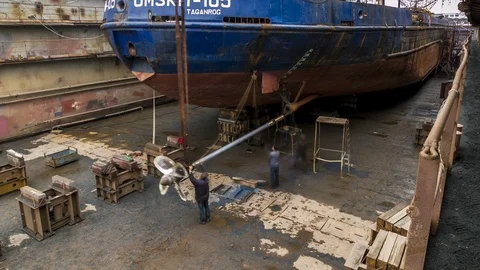 Working in the dry dock set screw shaft in the ship. Stock Footage 87013477