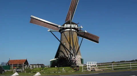 A working Dutch windmill and a water wheel Stock Footage 37281365