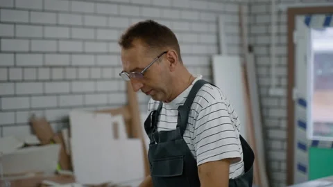 Working with an electric saw. Handheld shooting. Stock Footage 219728626