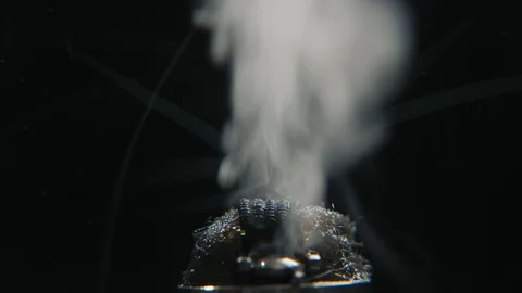 Working electronic cigarette. Macro of fused coil in e-cig, steam in 4k Vidéo 103112197