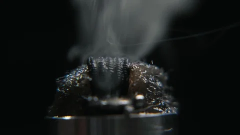 Working electronic cigarette. Macro of fused coil in e-cig, steam in 4k Stock Footage 103112207