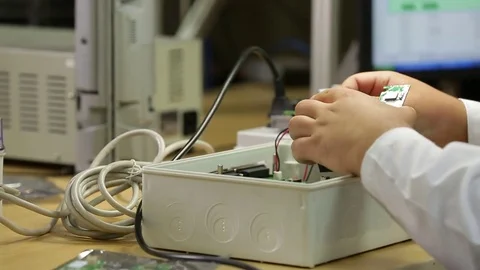 Working on electronic device Stock Footage 77048415