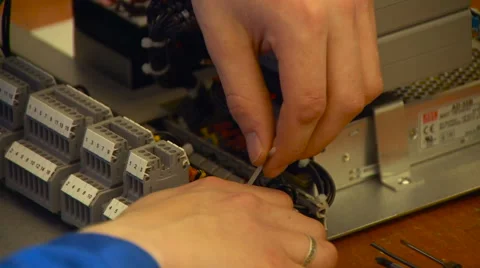 Working on Electronical Mechanism Close up Stock Footage 67457168