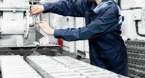 Working engineer performs work on setting up industrial repairs of equipment in 스톡 사진