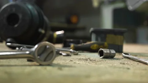 Working environment in car workshop. Worker take a wrench, screwdriver for work Stock Footage 155729710