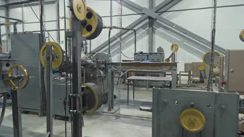 Working equipment in a modern workshop for the production of electric cable for Stock Footage 194954356