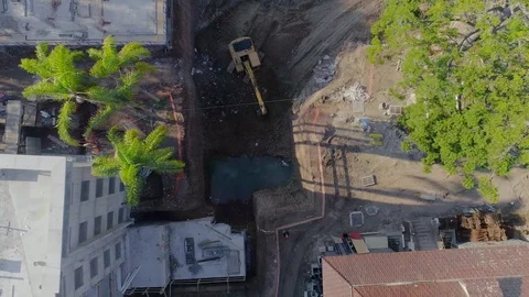Working excavator on a construction site, top view Stock Footage 102828727