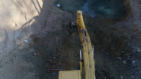 Working excavator on a construction site, top view Stock Footage 102828941