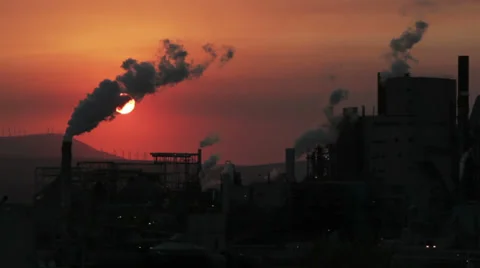Working Factory during Red Sky Hazy Sunset Stock Footage 33465194