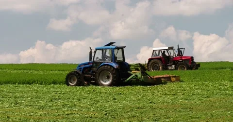 Working on a farm field -- mowing 動画素材 89439744