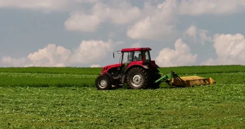 Working on a farm field -- mowing 動画素材 89439954
