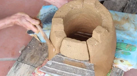 Working in the fields, doing soil oven Stove Stock Footage 49699238