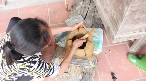 Working in the fields, doing soil oven Stove Stock-Footage 49699578