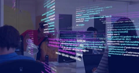 Working five colleagues in hoodies coding at shared desk in office with Foto stock