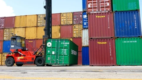 Working of fork lifting equipment container in warehouse (operator blur) Stock Footage 92143482