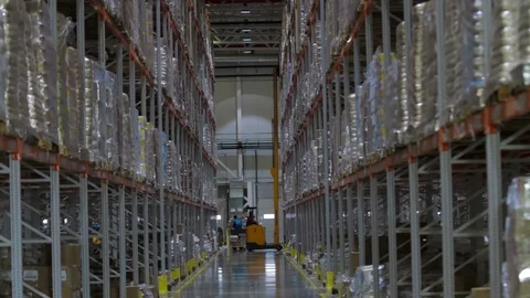 Working forklift inside a huge warehouse Stock Footage 90997460
