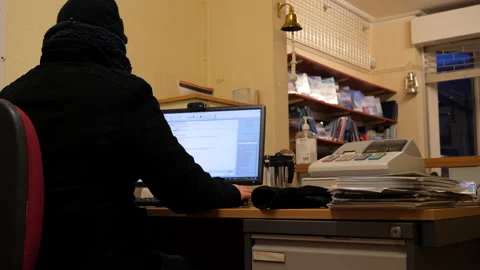 Working in a freezing cold office Stock Footage 148177128