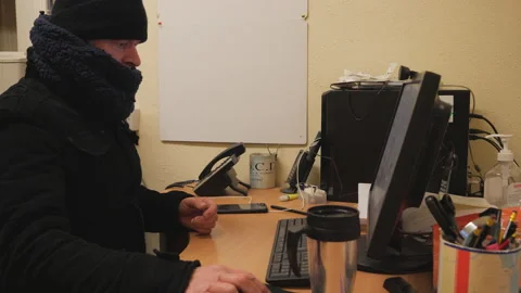 Working in a freezing cold office Video stock 148241611