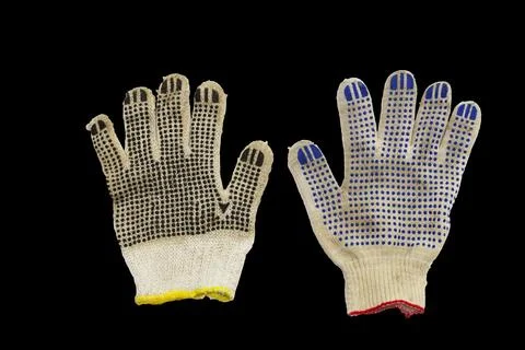 Working gloves, with colored rubber dots, black background, with clipping pat Stock Photos