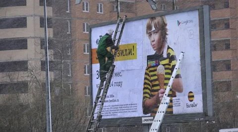 Working glued billboard. 4K. Stock Footage 45834824