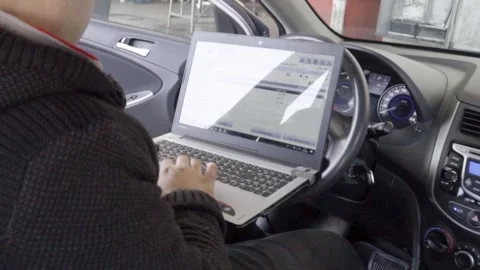 Working on the Go, Close-Up of Hands Using a Laptop in a Car, On the Go- Clo Stock Footage 287645240