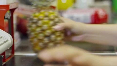 Working on grocery store checkout counter. cashier scanning items on modern Stock Footage 334644671