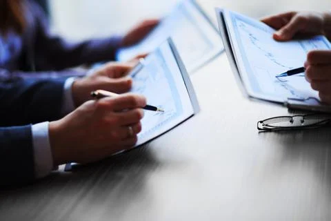 Working group discussing business documents . close up. Stock Photos