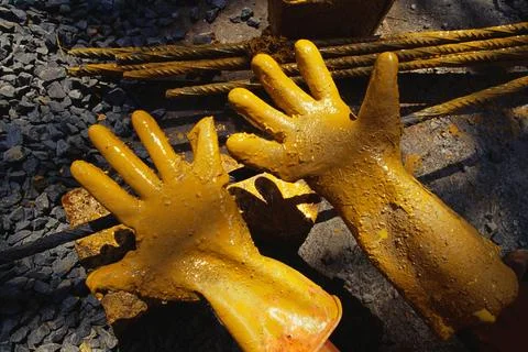 Working hands gloves Stock Photos