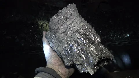 Working hands hold coal in the mine Stock-Footage 94123148