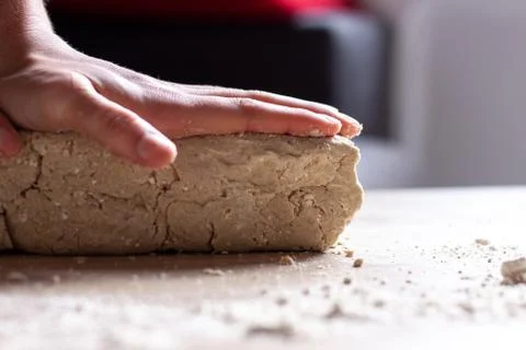 Working hands kneading bread dough Stock Photos