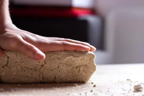 Working hands kneading bread dough. Handmade concept Stock Photos
