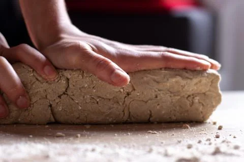 Working hands kneading bread gluten free dough. Handmade concept Stock Photos