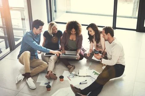 Working hard to avoid any potential pitfalls. a team of designers brainstorming Foto stock