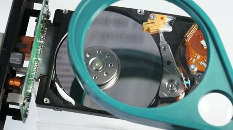 Working hard disk drive (hdd) with magnifying glass Stock Footage 10894988