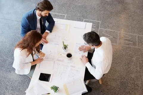 Working hard on their plans Stock Photos