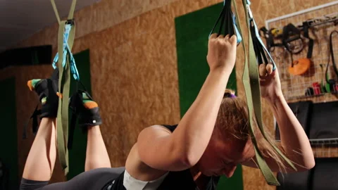 Working hard. View of young athletic woman, perfect body in sportswear hanging Stock-Footage 201553518