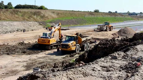 Working with heavy construction equipment building a road Stock Footage 41449433
