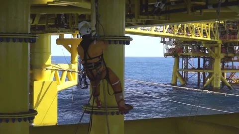 Working at height and overboard using abseiling technique. Stock Footage 83605536